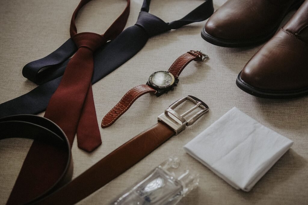 old money accessories for men including watch and leather belt