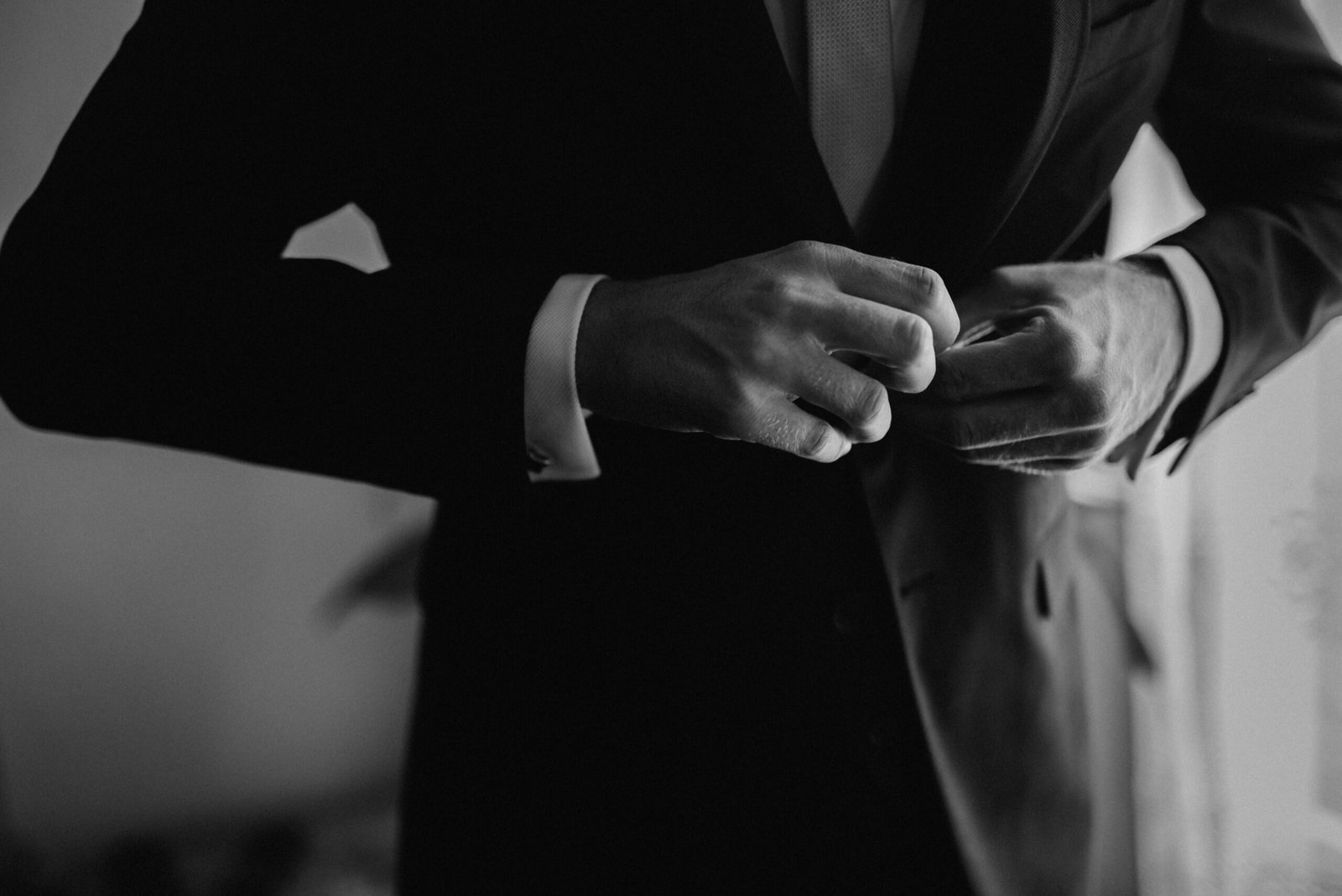 Stylish man wearing a tailored navy suit for a formal occasion